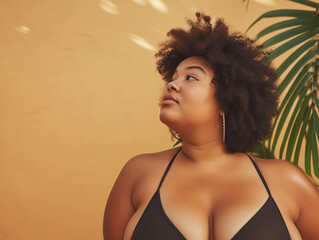 Beautiful plus size black woman in bikini - obrazy, fototapety, plakaty