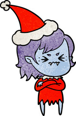 annoyed textured cartoon of a vampire girl wearing santa hat