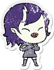 distressed sticker of a cartoon laughing vampire girl with crossed arms
