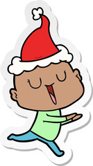 happy sticker cartoon of a bald man wearing santa hat