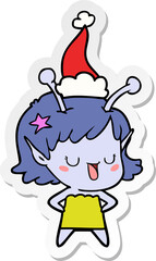 happy alien girl sticker cartoon of a wearing santa hat