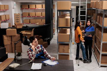 Delivery operators managing warehouse product audit in storage room. Retail industry storehouse...