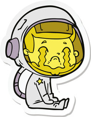 sticker of a cartoon crying astronaut