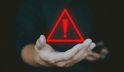 Alert alarm warning sign on hand, concept of emergency caution and system alarm.