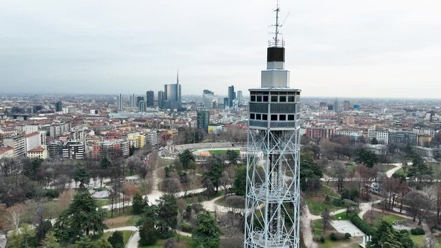 Business buildings against the backdrop of an ancient observation tower in Milan