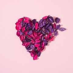 Heart made of pink and purple leaves. Valentines background.