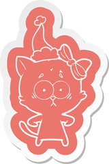 cartoon  sticker of a cat wearing santa hat