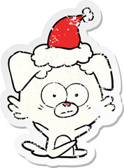 nervous dog distressed sticker cartoon of a wearing santa hat