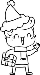 Fototapeta premium line drawing of a laughing boy wearing santa hat