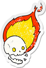 distressed sticker of a spooky cartoon flaming skull