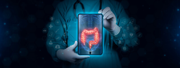 The doctor analyzes the colon x-ray. analyzes the x-ray of the lower gastrointestinal tract. Image of tablet on digital technological background. - obrazy, fototapety, plakaty