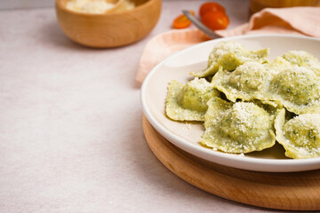 Plate of tasty ravioli with cheese on white background, closeup