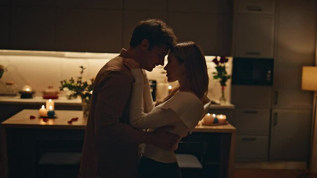 Passionate couple dancing home kitchen close up. Happy lovers moving slowly 