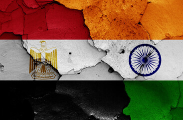 flags of Egypt and India painted on cracked wall