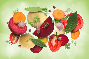 Different fresh vegetables and spices in air on green background