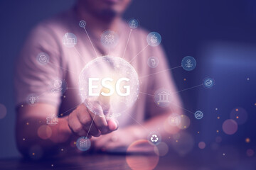 ESG sustainable investment concept, investor touching environmental social governance( ESG) icon on...