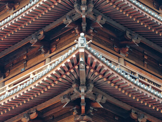 Chinese traditional eaves. The eaves of traditional temples. Beautiful Chinese traditional eaves. Close up view, wooden structure.