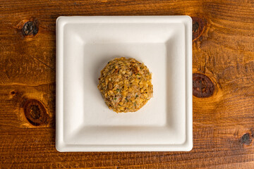 Uncooked crab cake on a plate