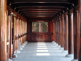 Beautiful wooden corridor of Baoshan Temple in Baoshan district, Shanghai, China. Bathed in summer sunlight.