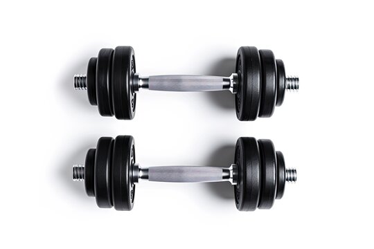 Two gym dumbbells white background space for text Top view flat lay Can be a gym background