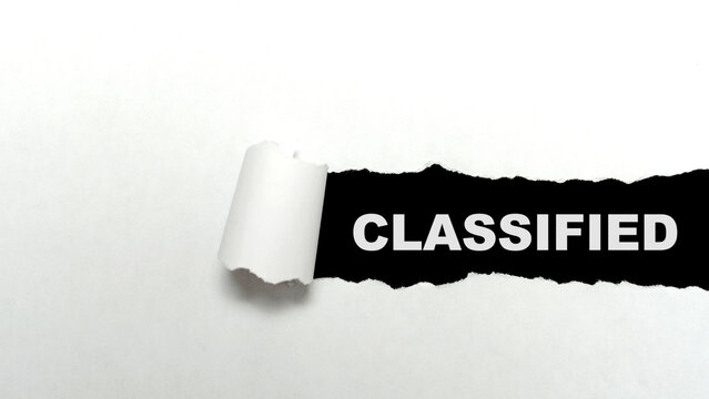Ripped paper with classified text