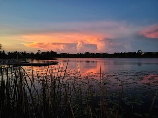 Naklejka premium Sunset at the dock on the lake 