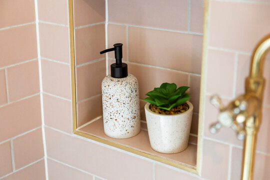 Ceramic Accessories Set in a Light Pink Tiled Shower Niche