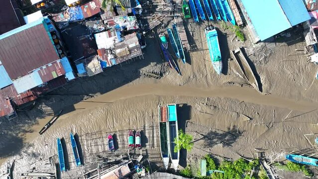 The condition of the river is receding, many boats are stranded and there are slum settlements of Asmat residents of Papua, Indonesia