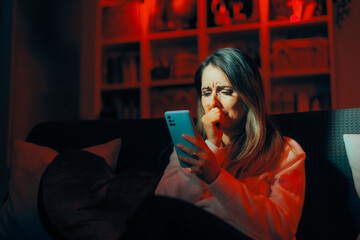 Woman Crying Reading a Text Message from Ex-Boyfriend. Upset woman feeling desperate after text...