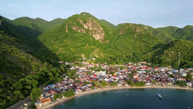 Gorontalo, Indonesia: Cinematic aerial drone footage of leato selatan village just outside Gorontalo by the Celebes sea in the Sulawesi island in Indonesia. 