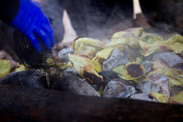 Photograph of preparation of Pachamanca in Peru. Food concept and traditions.