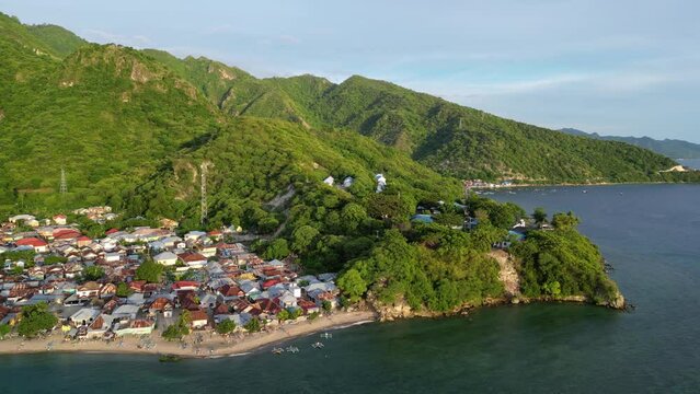 Gorontalo, Indonesia: Cinematic aerial drone footage of leato selatan village just outside Gorontalo by the Celebes sea in the Sulawesi island in Indonesia. 