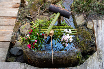 Tsukubai (washbasin) in the garden of Hosen-in temple in Kyoto, Japan