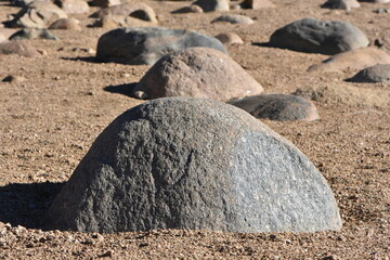 Weathered Boulders in Sand of Beach Area, Geology Rocks
