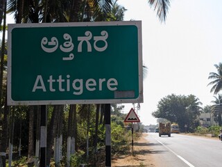 Green direction board at roadside in Karnataka India