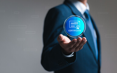 Quality Certificate concept. Businessman hold virtual certificate icon for quality management....