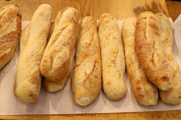 Bread and bakery products lie on display in a store.