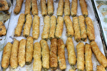 Bread and bakery products lie on display in a store.