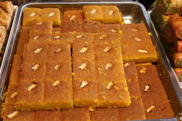 Bread and bakery products lie on display in a store.