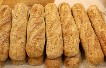 Bread and bakery products lie on display in a store.