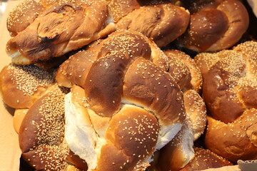Bread and bakery products lie on display in a store.