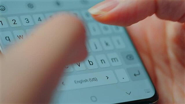 Female hands typing text on smartphone close-up.