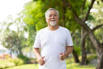 senior man running and exercising in the park