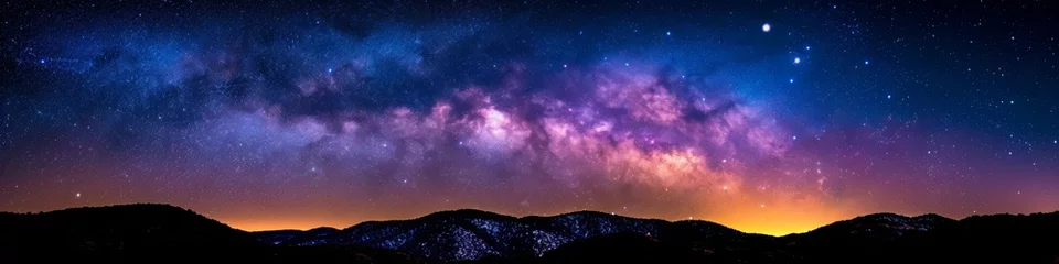 Tuinposter Cosmic Vibrance over Mountain Range with Starry Night Sky © Ross