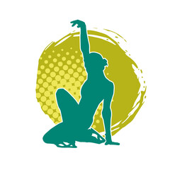 Silhouette of a slim female ice skate gymnastic dancer in action pose.