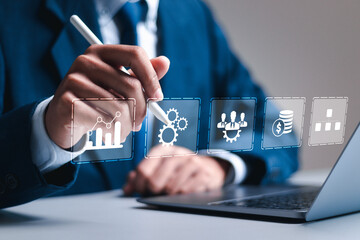 Business analytics concept, Businessman use laptop with virtual business strategy icon to analyze...