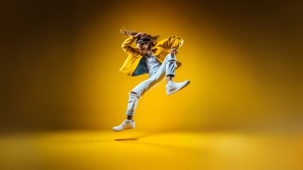 Fototapeta na wymiar Hip-Hop Elegance, a stunning silhouette captures the grace of a hip-hop dancer mid-jump, symbolizing the beauty of street dance white yellow gold theme. Generative AI.