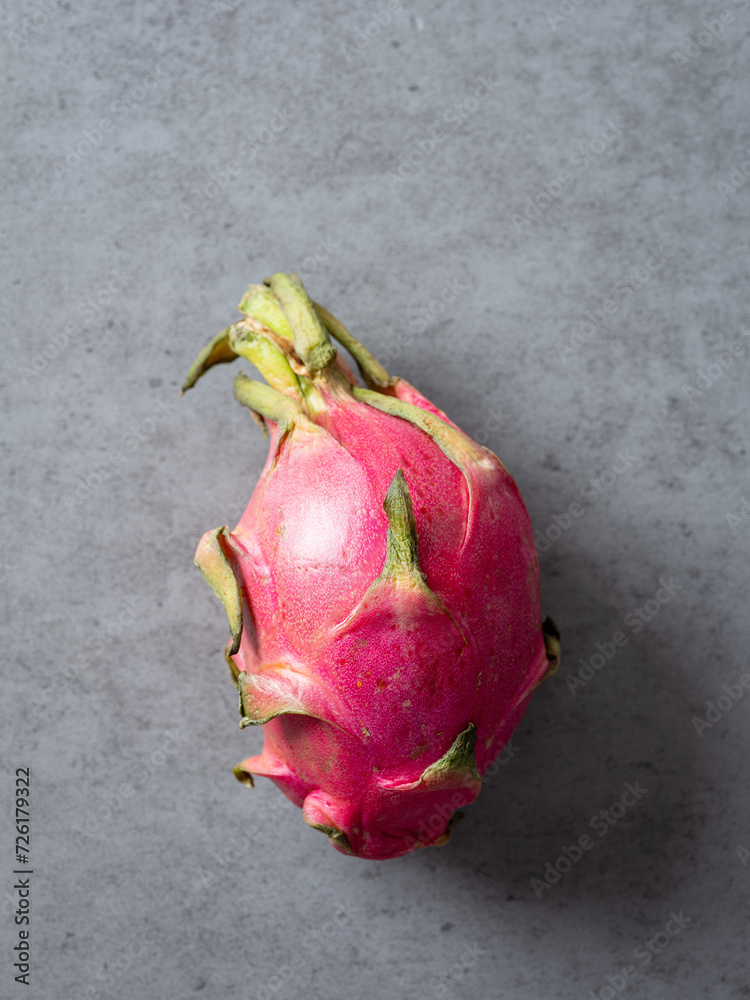 Wall mural dragon fruit on gray background