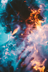 Fototapeta premium Portrait of a young man holding a fire in his hands.
