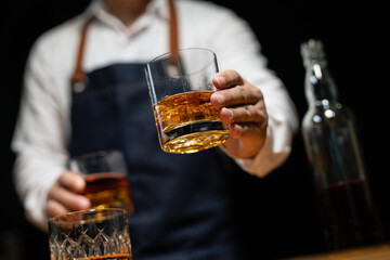 Barman pouring whiskey whiskey glass beautiful night